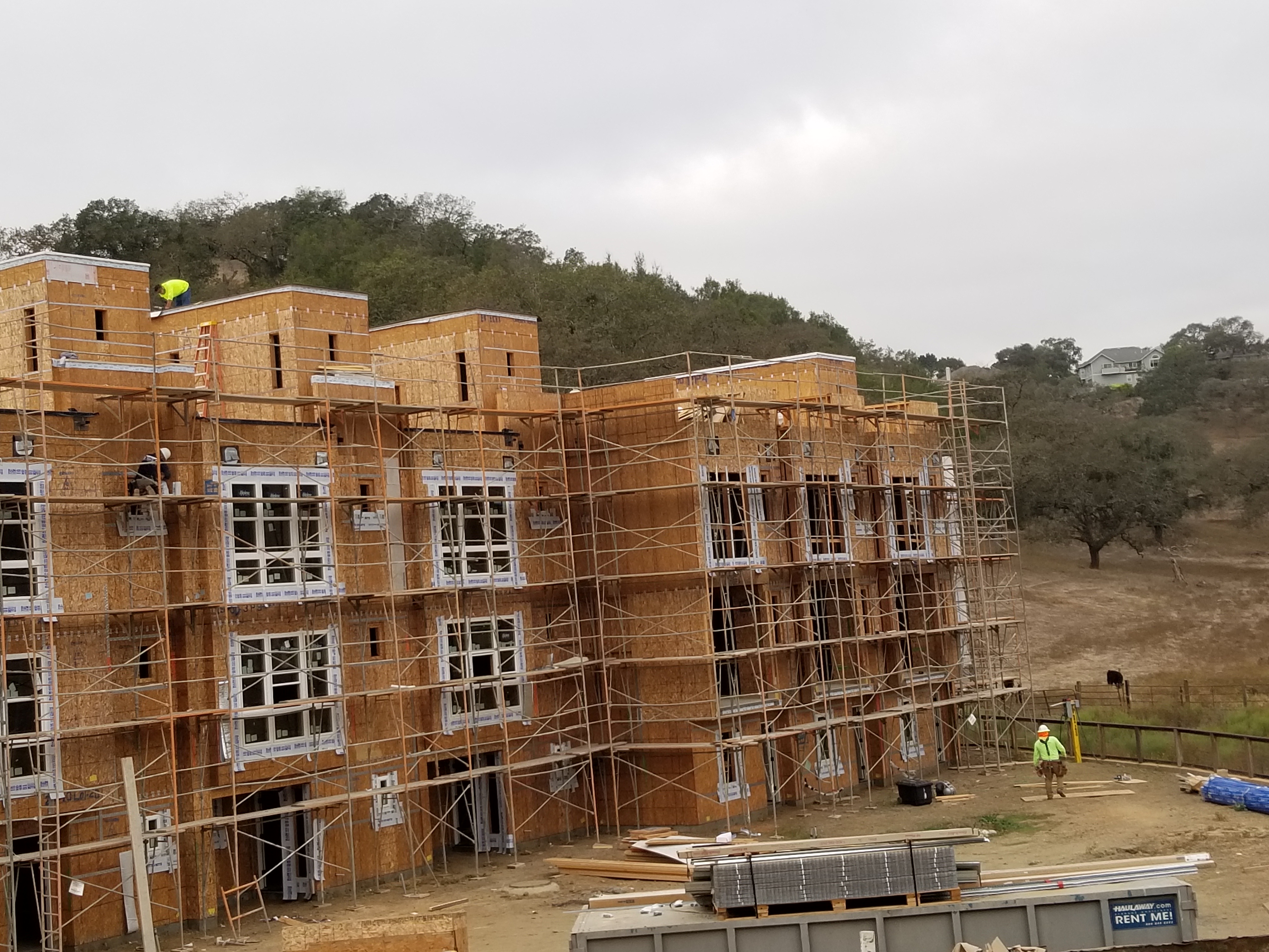 Multi-story apartment framing hillside