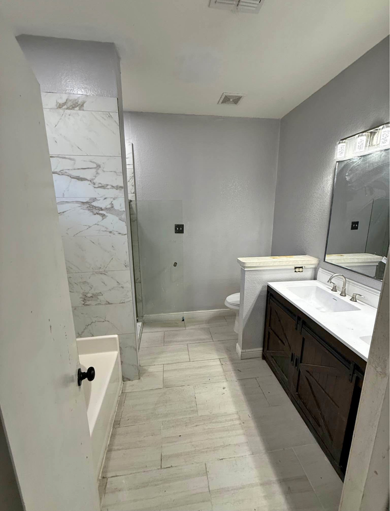 Dark gray kitchen marble island globe lights