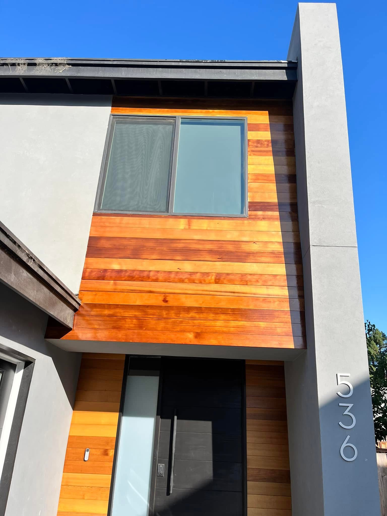 Cedar siding installation in progress
